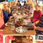 Our yoga group enjoying a delicious Greek vegetarian dinner on a Yoga Holiday in Crete