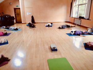 Yoga class in relaxation pose